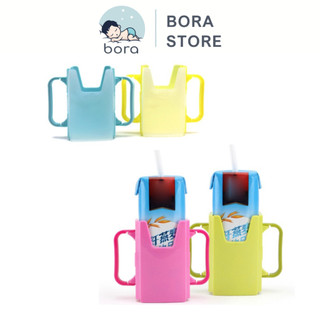 Hộp đựng sữa hộp có quai cầm, giúp bé tự uống sữa hộp dễ dàng
