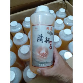 1 chai dầu massage thảo dược giúp săn chắc, tăng kích thước vòng 1, giá 219.000 đồng, sản phẩm thường dùng ở spa.