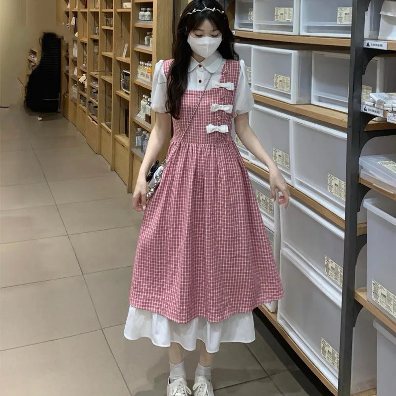 Váy Dáng Yếm 2 Lớp Đính Nơ Phối Liền Áo Sơmi Phong Cách Nữ Nhẹ Nhàng