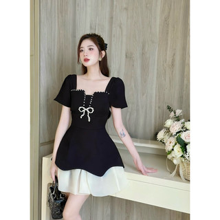 Váy đen nơ ngực đá