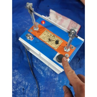 Máy cắt dây đai, tem, nhãn bằng nhiệt