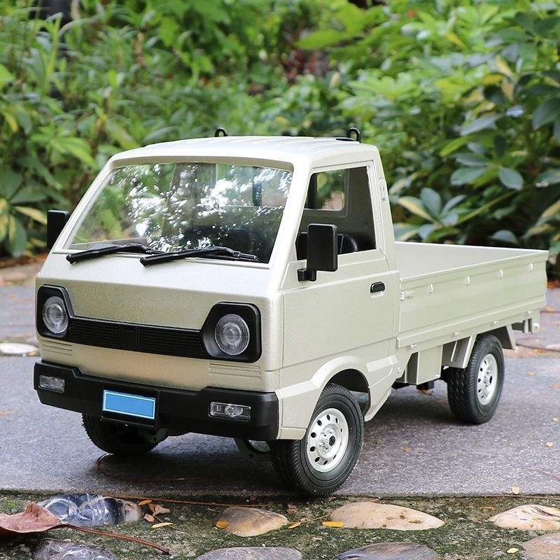 Xe Tải SUZUKI WPL Mô Phỏng Theo Tỉ Lệ 1:10 Có Giảm Xóc Và Trục Chuyển Động Điều Khiển Từ Xa Kèm Pin Sạc