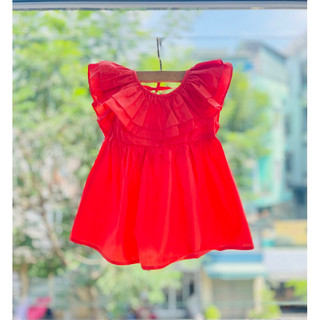 Váy thô màu cam nhún bèo dành cho bé gái