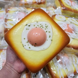 squishy bánh mì trứng rán chất bơ kèm hộp mica như hình,chậm tăng