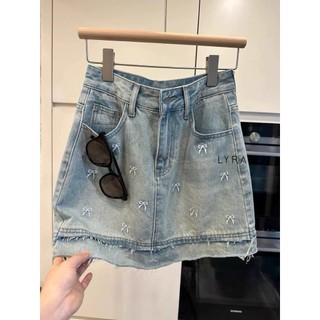 LYRA - Chân váy jean thêu nơ gấu tua rua trẻ xinh hack tuổi - CSYCN0182