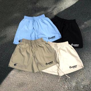 Codes Studio | Quần short dù nhăn lót lưới hình thêu Codes Studio from rộng trên gối nhiều màu unisex