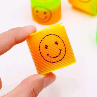 Đồ chơi lò xo 7 sắc cầu vòng mặt cảm xúc,,,
