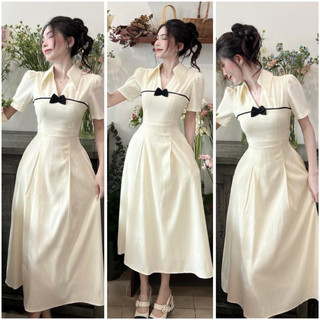 Đầm kem cổ v nơ đen tùng xoè xếp li