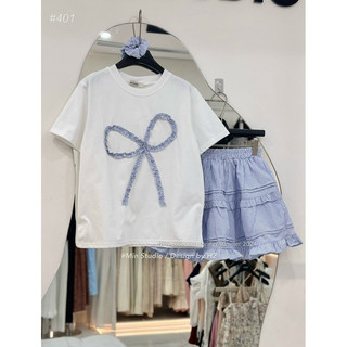 Set áo nơ xanh mix chân váy kẻ