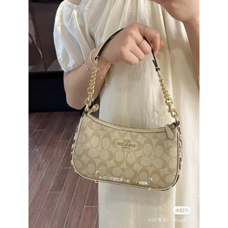 Túi Coach dáng thuyền Teri Shoulder Bag In Signature Canvas