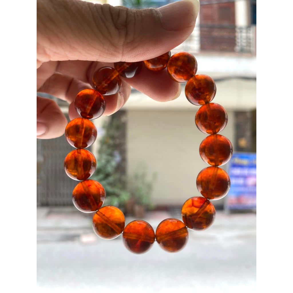 Vòng hổ phách vân mây màu cognac