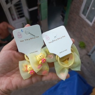 Một cặp thun cột tóc nơ/hoa cho bé