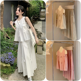 Sét váy thô mịn gồm áo 3 lỗ babydoll gắn 6 nơ + chân váy xoè dáng dài