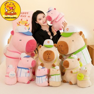 Gấu bông chuột capybara hồng - capybara nâu mặc áo đeo bóng - chuột lang nước capybara đáng yêu cao cấp gấu bông city