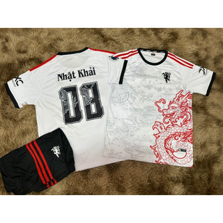 Bộ quần áo bóng đá Mu Dragon trắng . Vải thun lạnh thoáng mát, Logo thêu. In tên số theo yêu cầu