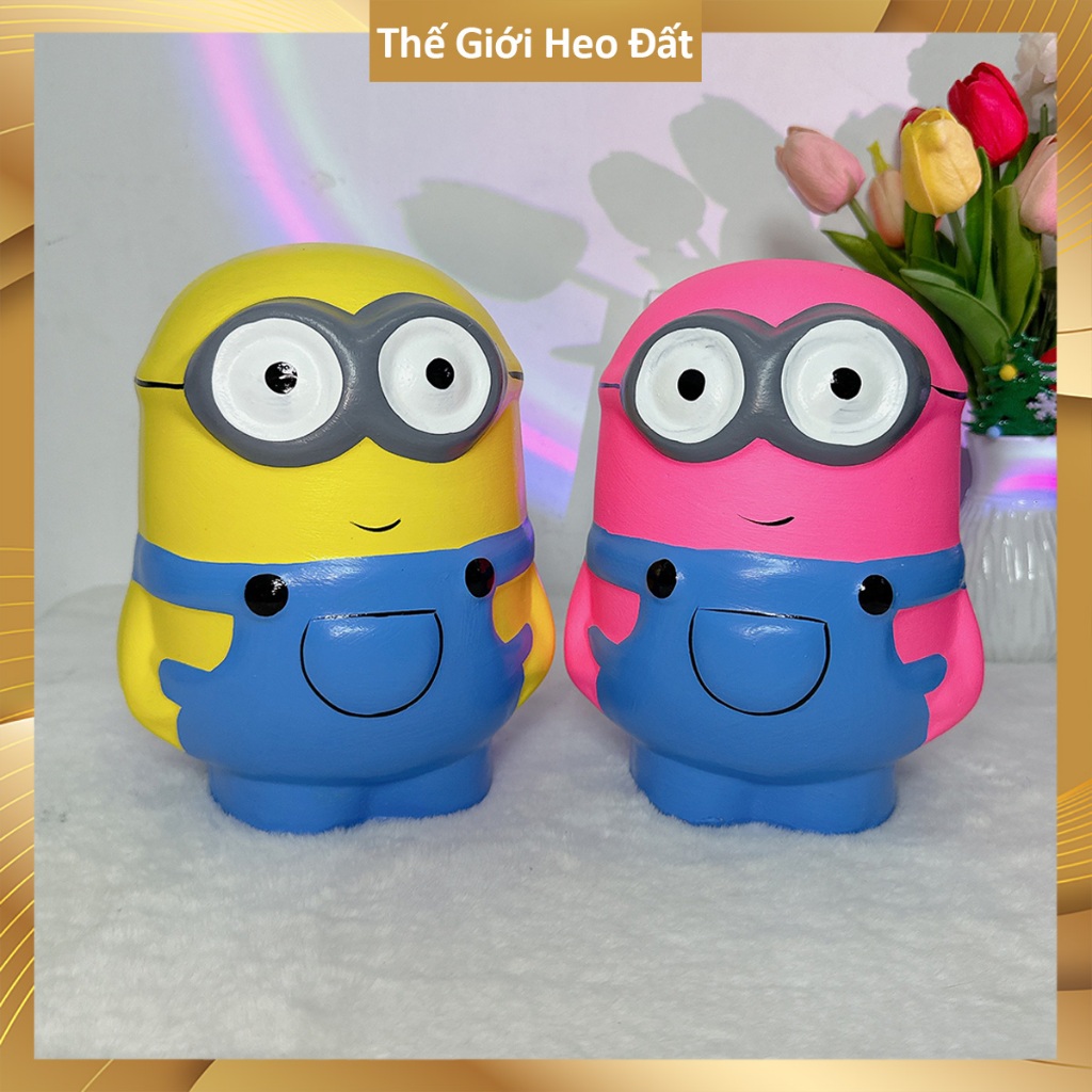 Heo đất tiết kiệm hình minion đẹp 2026, ống con lợn đất dễ thương size vừa cao khoảng 20-22cm