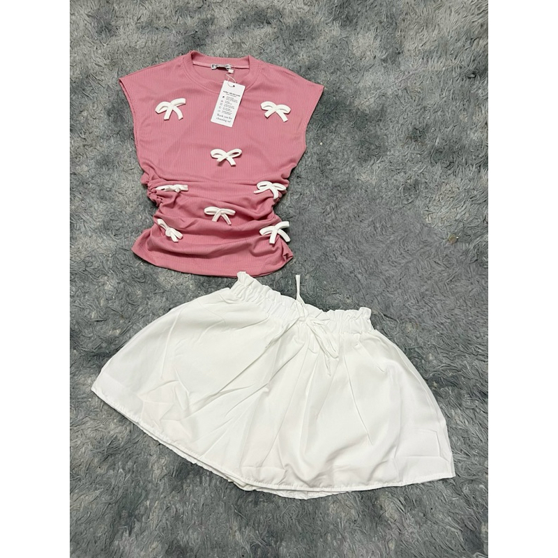 Set Bộ Áo Thun Babytee Tay Ngắn Raplang Đính Nơ Nổi Croptop + Chân Váy A Xoè Có Lót Quần | BigBuy360 - bigbuy360.vn