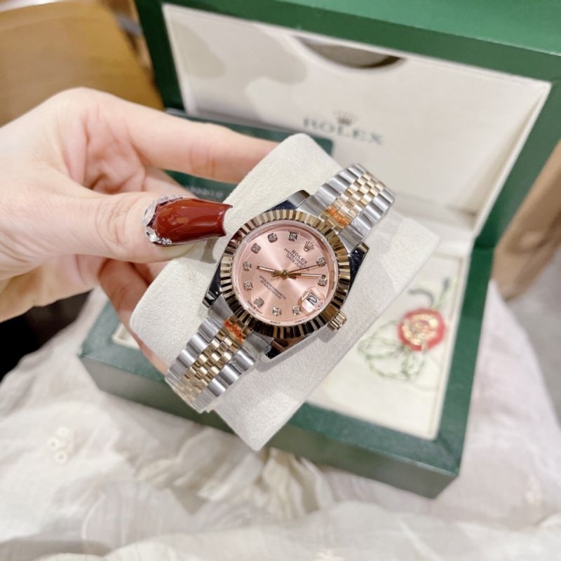 Đồng Hồ Rolexx Nữ Máy Quartz (Pin) Kính Sapphiare Mặt Tròn Siz 31mm Dây Kim Loại Mặt Hồng Ghi Niềng 