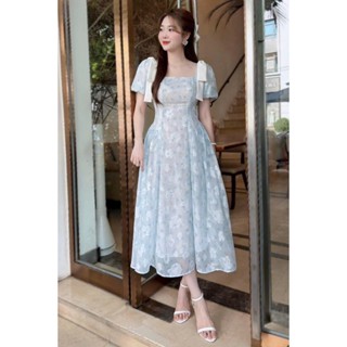 Đầm lụa hoa ép nhiệt mặc đi biển chất siêu mát thiết kế cổ vuông tay phồng đính nơ hai bên váy xòe nữ tính