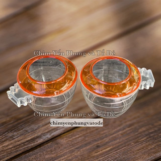 1 cóng nhựa nhỏ viền cam đựng Khoáng, Vitamin cho chim cảnh.