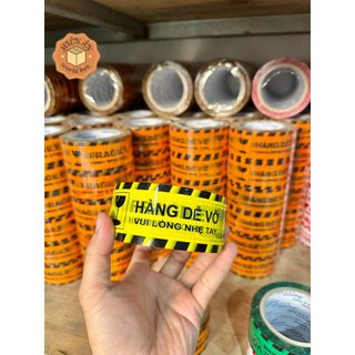 CUỘN BĂNG KEO NIÊM PHONG IN CHỮ HÀNG DỄ VỠ SONG NGỮ TIẾNG ANH VÀ TIẾNG VIỆT LOẠI 100Y(NHIỀU MÀU SẮC)