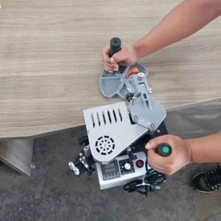 May dán cạnh mini  DW100 cầm tay