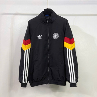 Áo khoác gió thể thao nam nữ Das thêu logo cỏ ba lá ngực phối 3 sọc đỏ vàng tay lót 2 lớp dày dặn cho các boy phố 2024