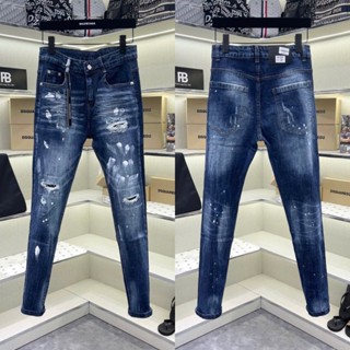 Quần jean bò nam DSQ slimfit xanh đậm mài rách tua sợi lót vải đùi gối vảy sơn dập nhăn 3D boy phố QJ596P