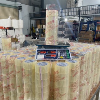  Băng keo 100 yard 1kg trong vàng đục lõi mỏng 5li 1 cây gồm 6 cuộn 