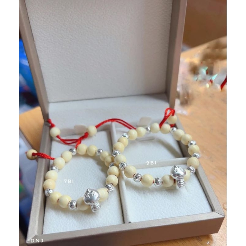 Vòng dâu charm con rắn bi bạc cho bé