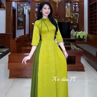 Áo dài gấm cô lệch đính nơ cúc cách điệu trẻ trung màu xanh cốm
