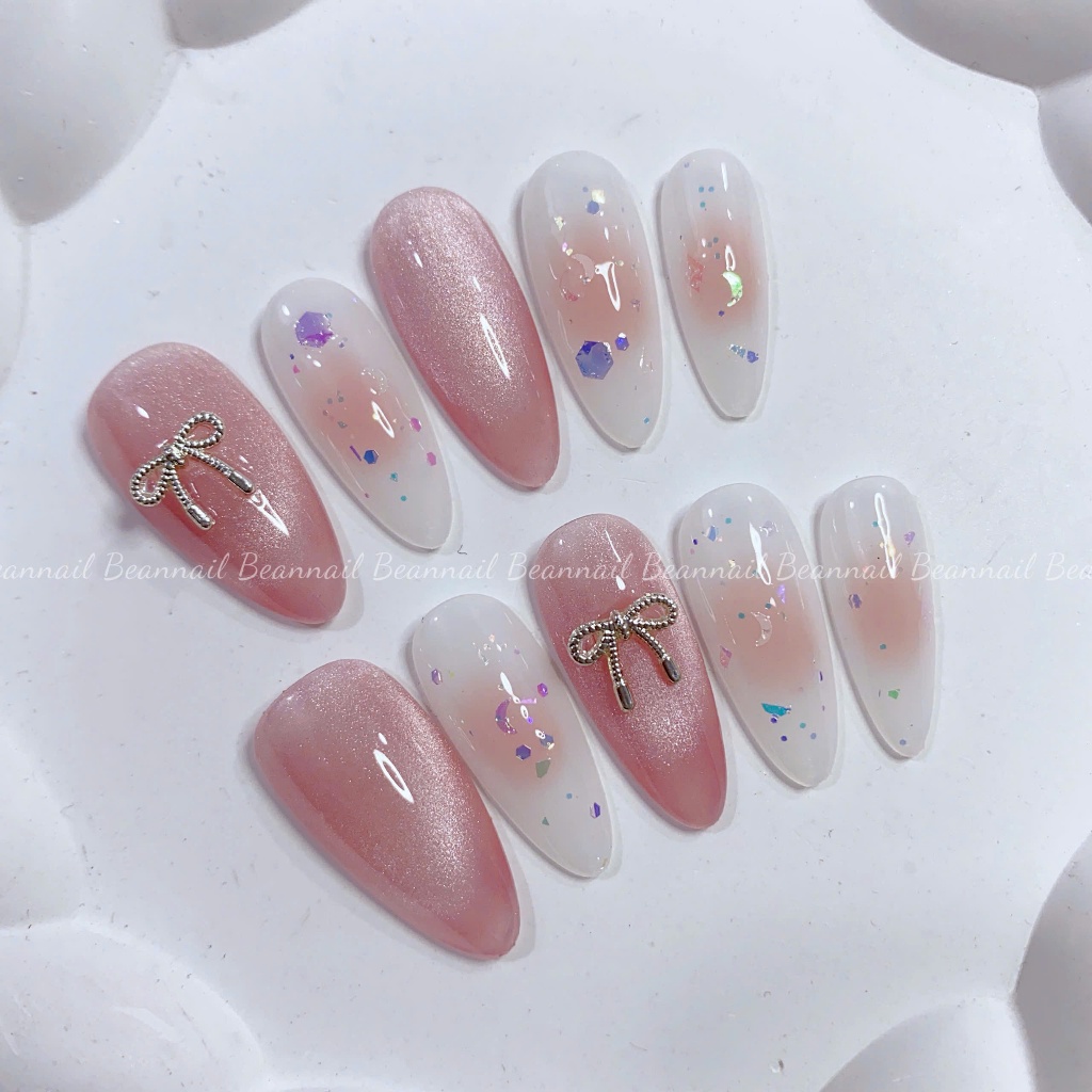 Móng úp thiết kế mắt mèo ánh trăng hồng đính nơ mix loang hồng + nhũ - B193