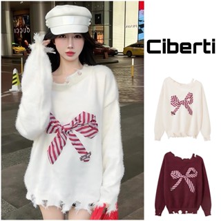 Áo len trễ vai rách đính nơ ngực Ciberti