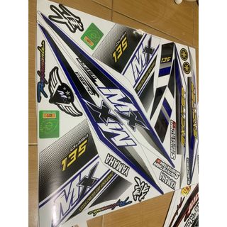 Tem exciter 135 MX trắng xanh đen