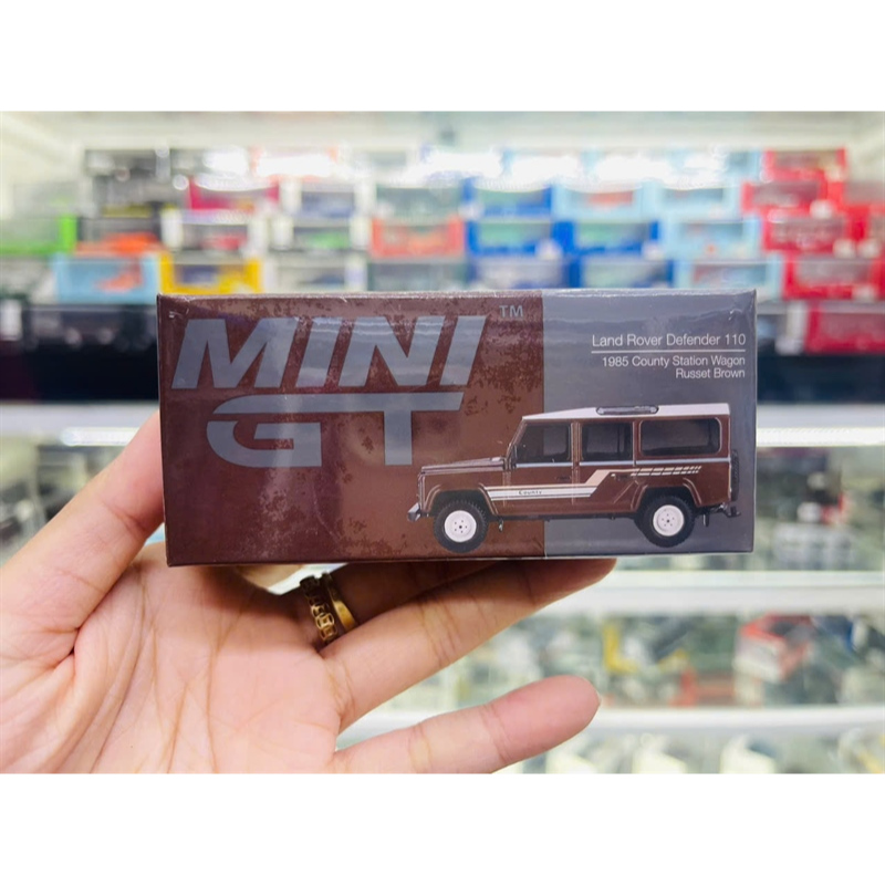 Mô hình xe Land Rover Defender 110 1985 County Station Wagon Russet Brown tỉ lệ 1:64 MiniGT MGT00734