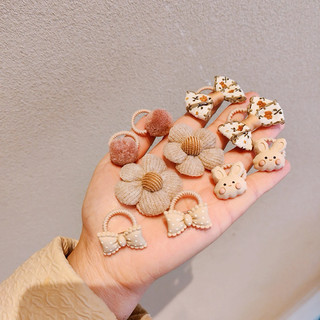 chun buộc tóc bé gái gắn nhiều hình đáng yêu