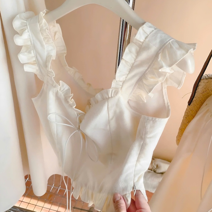 Set Áo Croptop 2 Dây Nude Phối Viền Bèo Cột Nơ Nguc + Chân Váy Midi Dáng Dài Chất Liệu Thô | BigBuy360 - bigbuy360.vn
