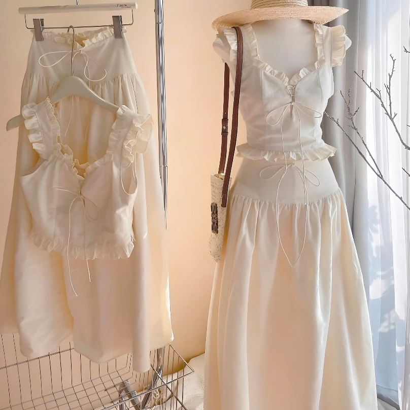Set Áo Croptop 2 Dây Nude Phối Viền Bèo Cột Nơ Nguc + Chân Váy Midi Dáng Dài Chất Liệu Thô | BigBuy360 - bigbuy360.vn