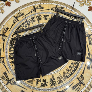 Quần đùi nam nữ thiết kế đen trơn gắn tag da logo ĐÊ GỜ, quần short gió  hot 2025