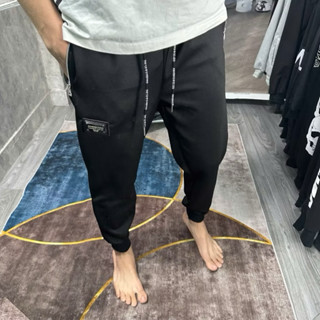 Quần dài nam đôn chề logo khoá túi dây chữ