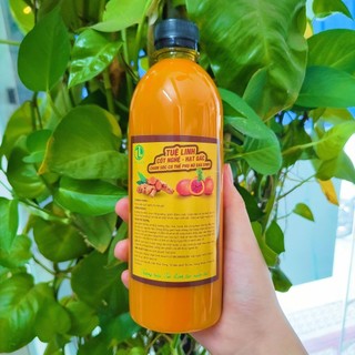 500ml cốt nghệ hạt gấc Tuệ Linh thoa mặt sau sinh