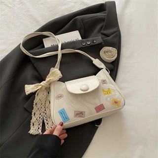  Túi xách nữ da sần pha màu đeo chéo kèm charm gấu và nơ ren phong cách dễ thương hàn quốc - TXN204 