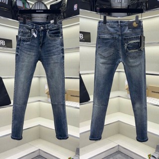 Quần jean bò nam Đôn Chề slimfit xanh nhạt trơn xước phối túi sau vá logo dập nổi chữ rách viền QJ594P