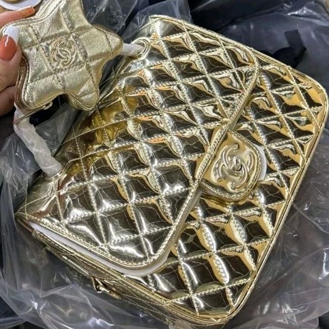 Ba lô da thật kèm sao  ( size  25_ cod chip- gold+ bạc )