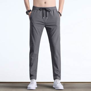 Quần dài thể thao nam vải dù mềm,co dãn nhẹ, có khóa túi phom dáng đẹp mặc được 4 mùa
