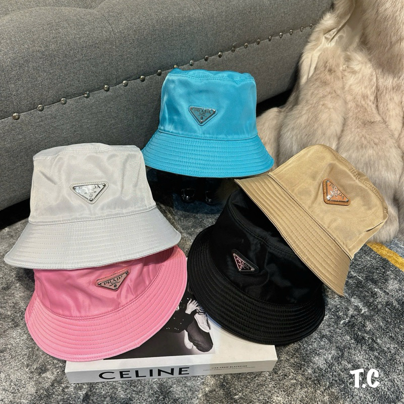 Cặp mũ bucket và lưỡi trai prada gió