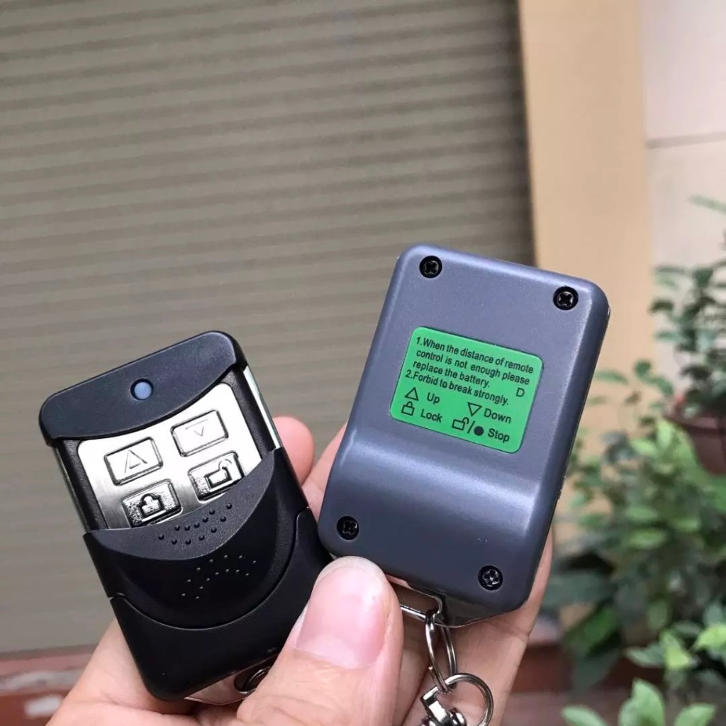 Remote điều khiển cửa cuốn TEC 433Mhz, pin 12V, viền kim loại + nhựa ABS cao cấp