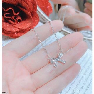 Dây chuyền nơ bạc xi vàng