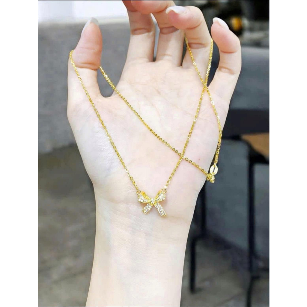 Dây chuyền nơ bạc xi vàng