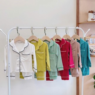 [Bé 9-40kg] Bộ Dài Tay Pijama Nút Cài Giữa Màu Trơn Chạy Viền Có Túi Thun Lạnh Mềm Mịn Mát Cho Bé Trai, Bé Gái Mặc Ngủ